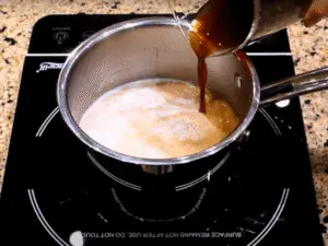 how to make cafe con leche - Combine Coffee and Milk